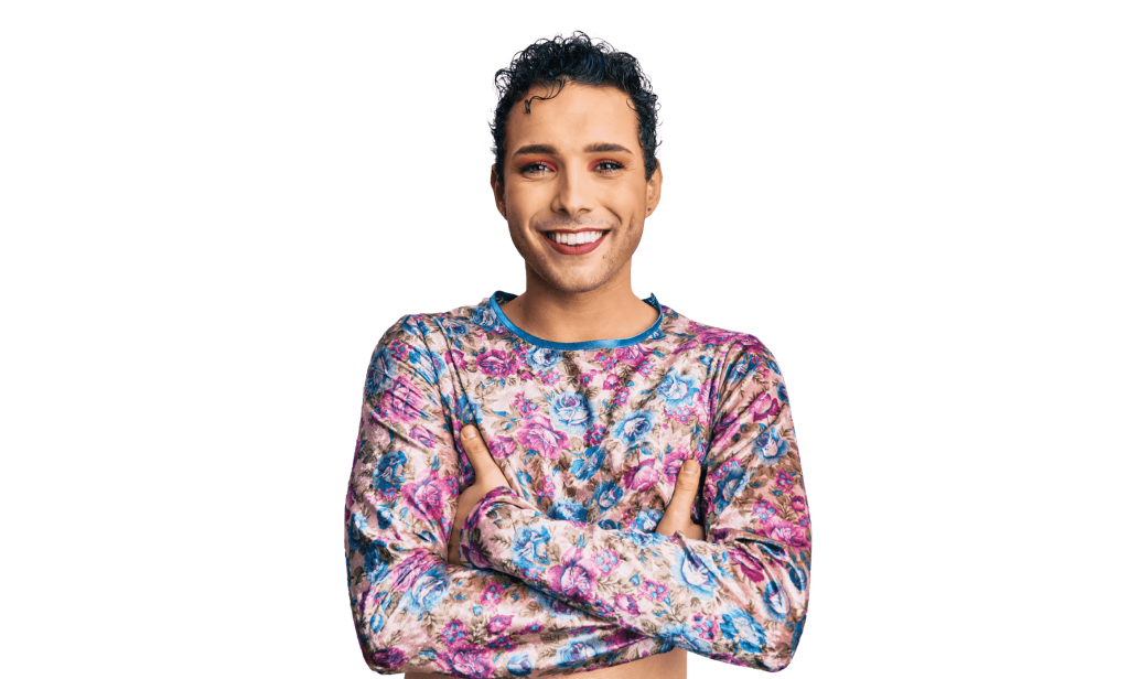 Non-binary person in floral shirt with arms crossed (image)